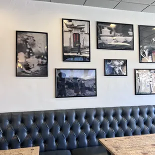 a wall of black and white photographs