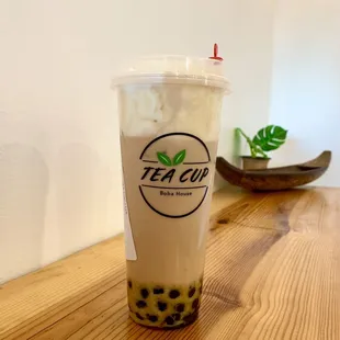Mango milk tea with crema and boba
