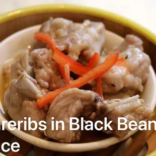 a bowl of soup with mushrooms and carrots