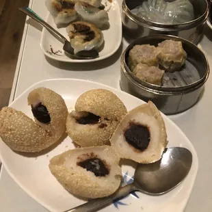 a plate of dumplings and a bowl of soup
