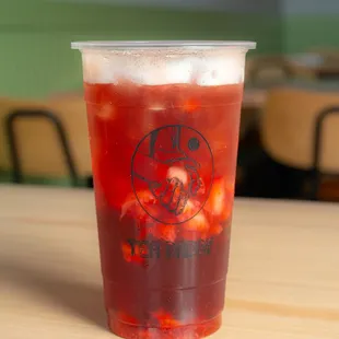 a cup of iced tea on a table