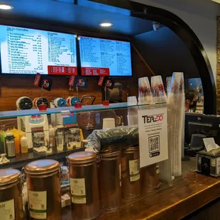 a coffee shop counter and menus