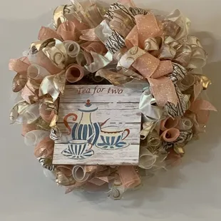 a wreath made of ribbon and ribbons