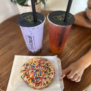 Taro Milk Tea with boba and Strawberry Oolong Tea with mango popping boba and a HUGE confetti cookie