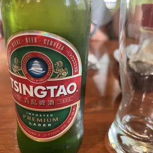 a glass of water and a bottle of stingato