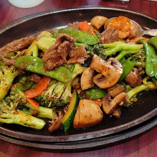 a plate of stir fried vegetables