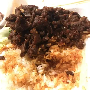 a plate of rice and meat