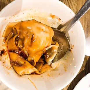 Dumpling in chili oil is delicious! BUT meat to wrap portion of off.