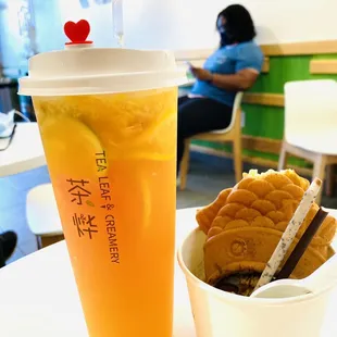 Fresh lemon green tea w. Taiyaki Ice cream these are so delicious. Fish tail is missing cause I took a bite it taking picture