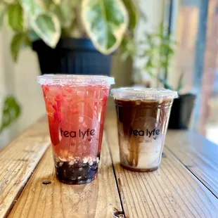 Strawberry lychee jasmine with boba on the left, hojicha latte on the right