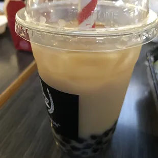 a cup of iced coffee on a table