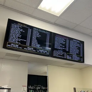 menus on the wall above the counter