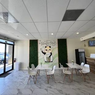 Beautiful panda mural and tables