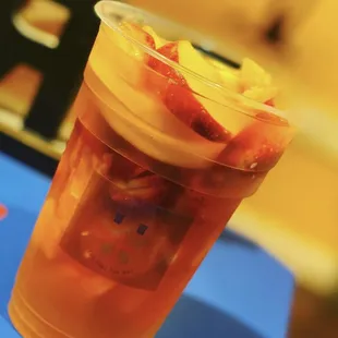 a cup of tea with strawberries