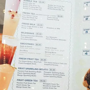 a person holding a menu