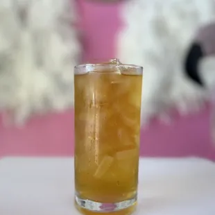 a glass of iced tea on a table