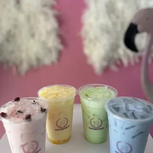 a variety of drinks in plastic cups