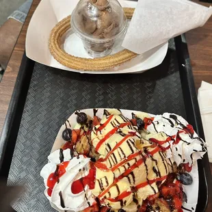 Fruity Churro and a churro with ice cream. Fruity churro was very good, fresh fruit and warm churro