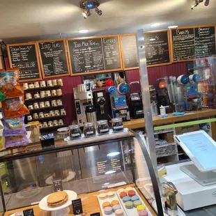 a coffee shop with menus on the wall