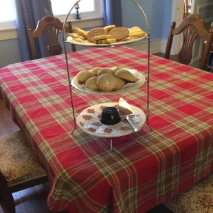 a table with a red tartan tablecloth