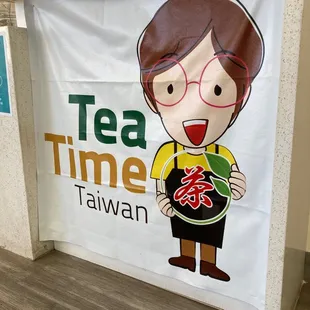 a woman holding a cup of tea