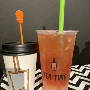 Green tea with strawberry flavor and lychee jelly at the bottom and a hot mocha latte