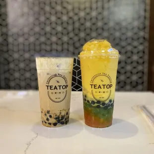 Lefi is brown sugar mt with milk foam, right is mango (or peach?) slushy with rainbow popping boba