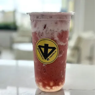 Strawberry cloud with crystal jelly / white boba topped with strawberry chunks