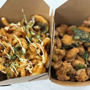 Saucy curly fries and popcorn chicken