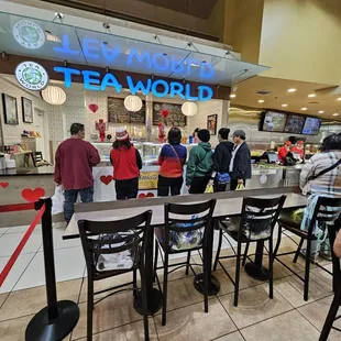 customers waiting in line at the counter