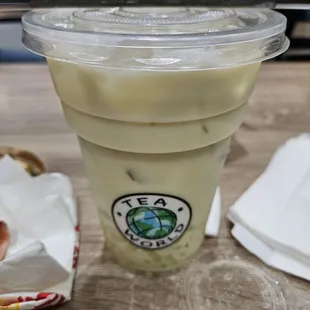 a hot dog and a drink on a table