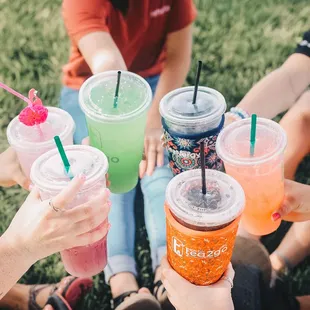 a group of people holding drinks