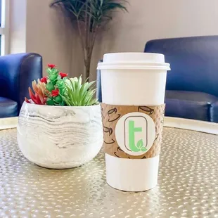 a cup of coffee on a table