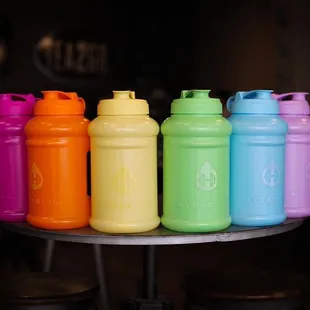 a row of colorful plastic water bottles