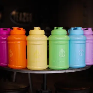 a row of colorful plastic water bottles