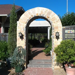 This archway leads to the vegetable and herb gardens.