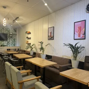 a restaurant with tables and chairs