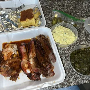 3 meat BBQ plate with ribs, brisket, and chicken with sides of greens, potato salad and Corn Bread.