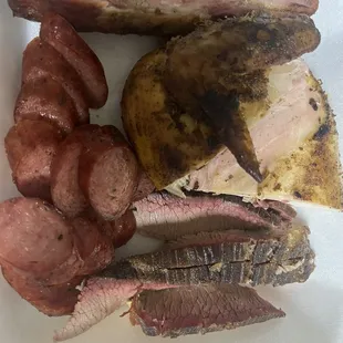 Four meat plate one rib sausage brisket dried chicken hill all the meat was dry