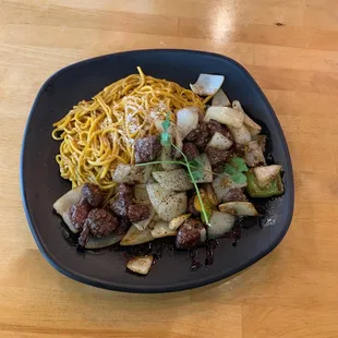 Garlic sake beef noodles. Generous portion size, smells amazing and tastes even better! The beef is so tender and juicy!