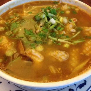 #17a Hot &amp; Sour Seafood and Pork Noodle Soup with bean sprouts, lemon glass, Thai ginger, ground peanuts, etc.