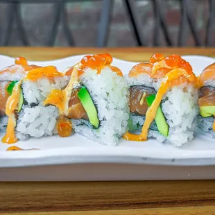 a plate of sushi rolls