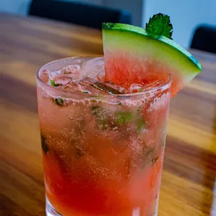a watermelon drink with a slice of watermelon