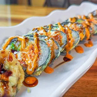 a plate of sushi rolls