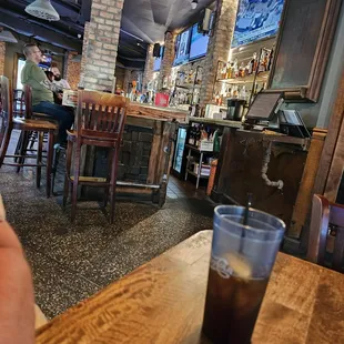 a person sitting at a bar