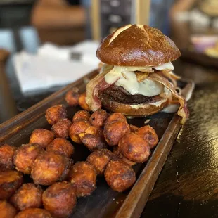 a burger and fried tater tots