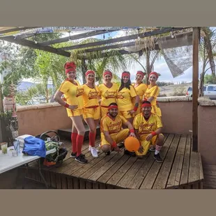 a group of people in yellow uniforms