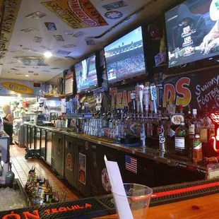 TVs behind bar.