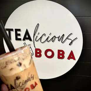 a person holding a drink