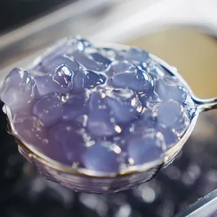  spoon filled with blue liquid